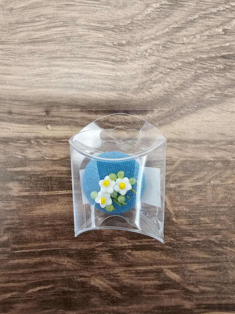 Flowers on blue wool button magnet